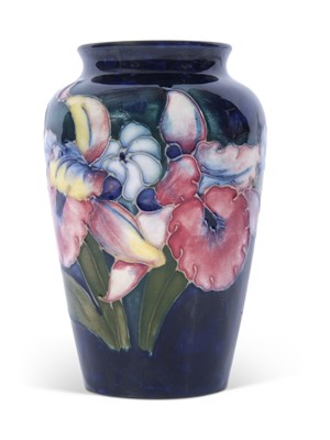 Lot 35 - Moorcroft vase in the orchid pattern on blue...