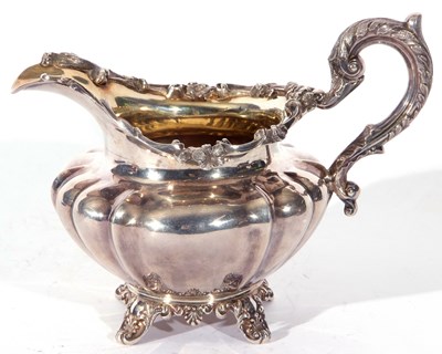 Lot 30 - William IV silver cream jug of rounded and...