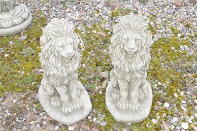 Lot 18 - Pair of small composite seated lions, approx...