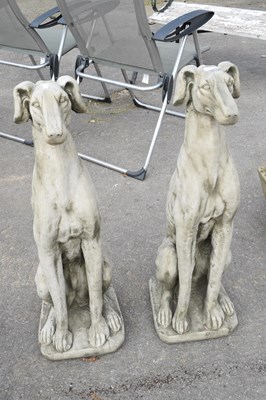Lot 46 - Pair of composite seated whippets, height...