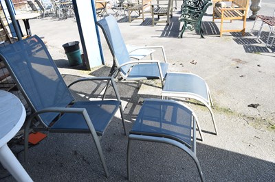 Lot 143 - Pair of garden sun loungers with foot rests...