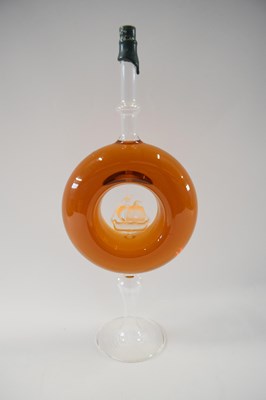 Lot 9 - Artisan brandy set in a circular bottle with...