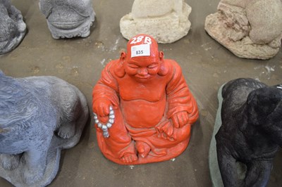 Lot 835 - Red composite model of a Buddha, height approx...