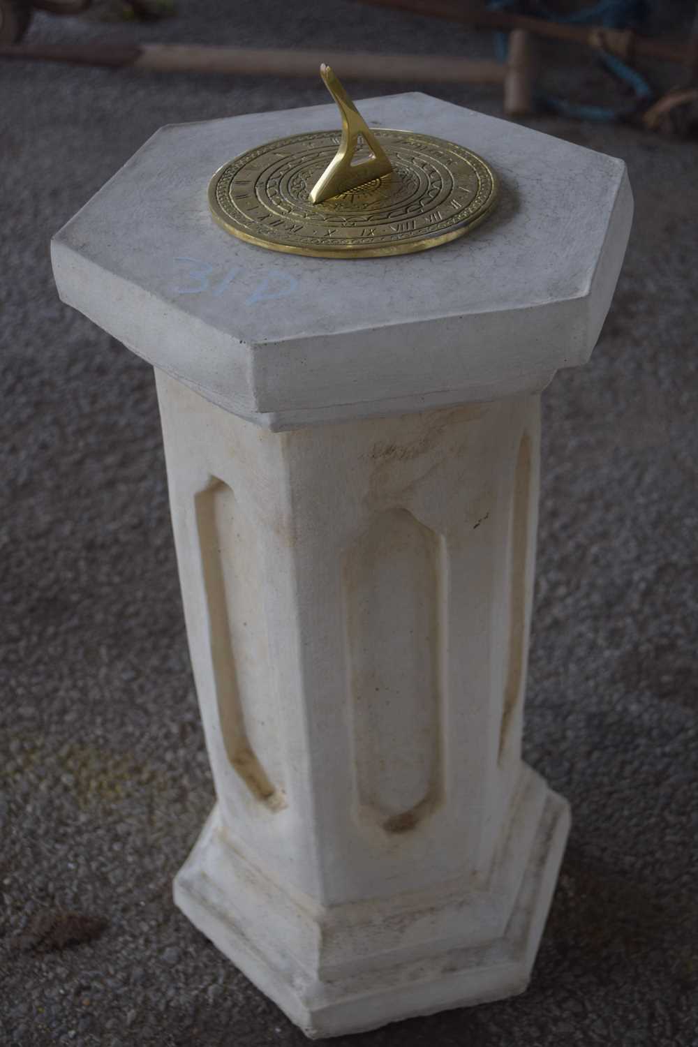 Lot 31 - Composite formed plinth with a brass sundial...