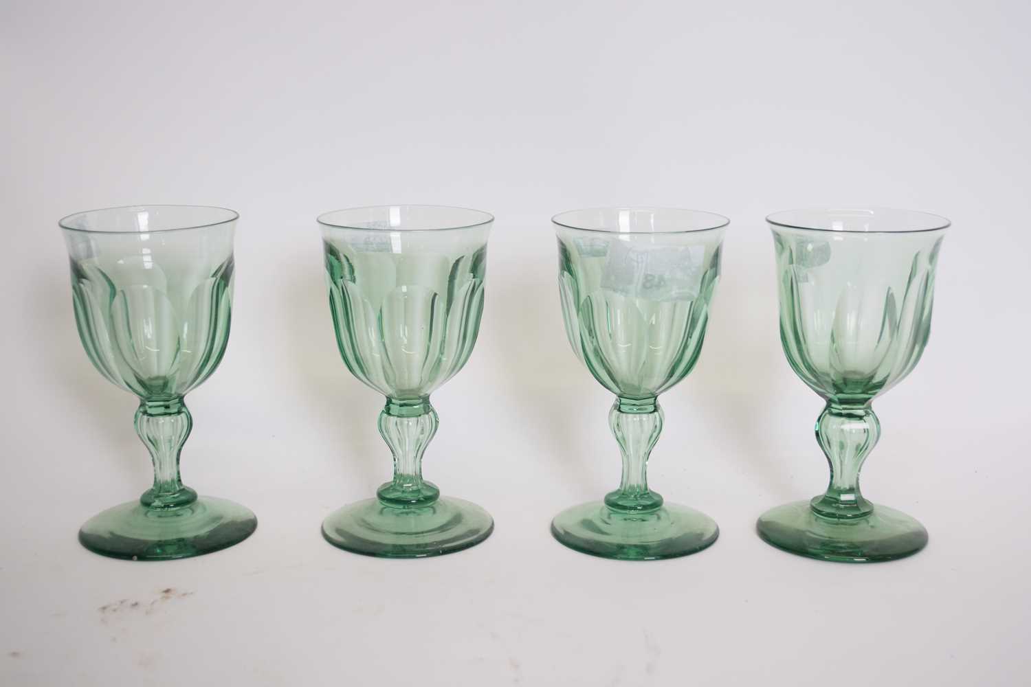 Lot 48 - Set of four green glass 19th century wine...