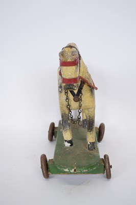 Lot 189 - Small wooden toy of a horse, on a rectangular...