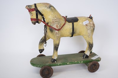 Lot 189 - Small wooden toy of a horse, on a rectangular...