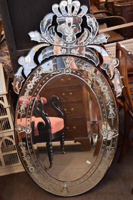 Lot 441 - A contemporary oval bevelled wall mirror set...