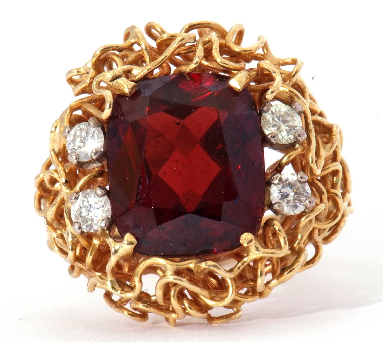Lot 5 - Modern garnet and diamond ring, the central...