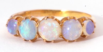 Lot 14 - Five stone opal ring, line set with graduated...