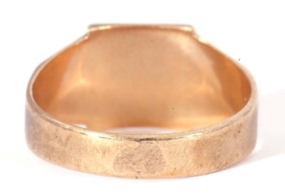 Lot 24 - 9ct gold gents signet ring of angular design,...