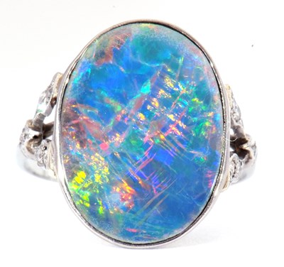 Lot 25 - Opal and diamond ring, the oval shaped flat...