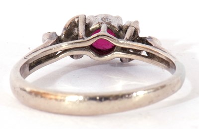 Lot 36 - Precious metal, ruby and diamond ring centring...