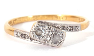 Lot 57 - Antique diamond cross-over ring centring two...