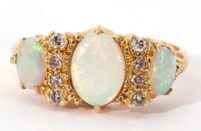 Lot 61 - 18ct gold opal and diamond ring featuring...