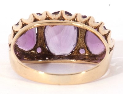 Lot 62 - 9ct gold three stone amethyst ring featuring...