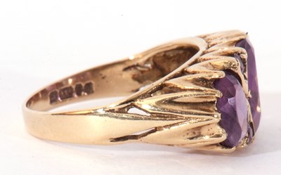 Lot 62 - 9ct gold three stone amethyst ring featuring...