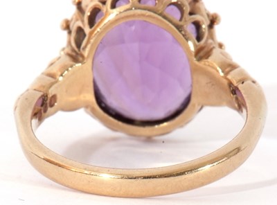 Lot 64 - Large amethyst dress ring, the oval faceted...