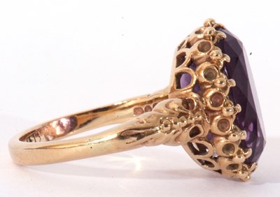 Lot 64 - Large amethyst dress ring, the oval faceted...