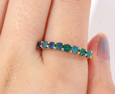 Lot 69 - Modern 9ct gold opal doublet 8-stone ring,...