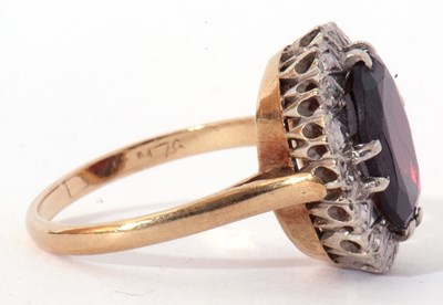 Lot 75 - Modern 9ct gold garnet and diamond ring, the...