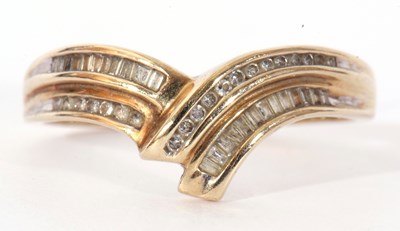 Lot 98 - Modern 9ct gold and diamond wishbone design...