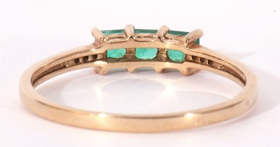 Lot 100 - Modern 9ct gold, emerald and diamond ring, the...