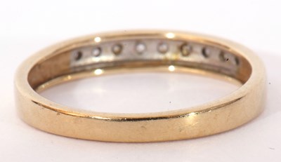 Lot 102 - Modern 9ct gold and diamond half hoop ring,...