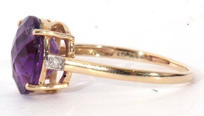Lot 120 - Modern 9ct gold amethyst and diamond ring, the...
