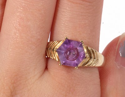 Lot 122 - Modern 9ct gold and purple crystal ring, the...