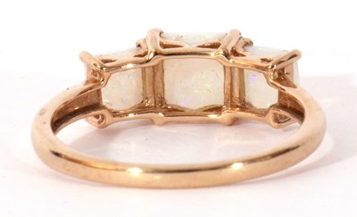 Lot 124 - Modern 9ct gold and white opal three stone...
