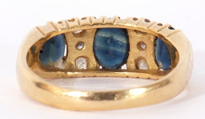 Lot 153 - Sapphire and diamond ring featuring three...