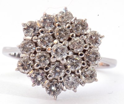 Lot 159 - Diamond cluster ring, a three tier design...