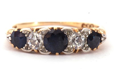 Lot 163 - Sapphire and diamond ring featuring three...