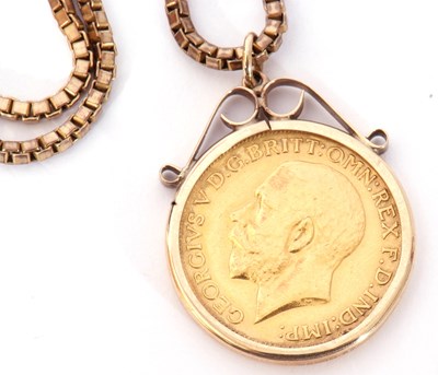 Lot 196 - George V gold sovereign framed in a 9ct gold...
