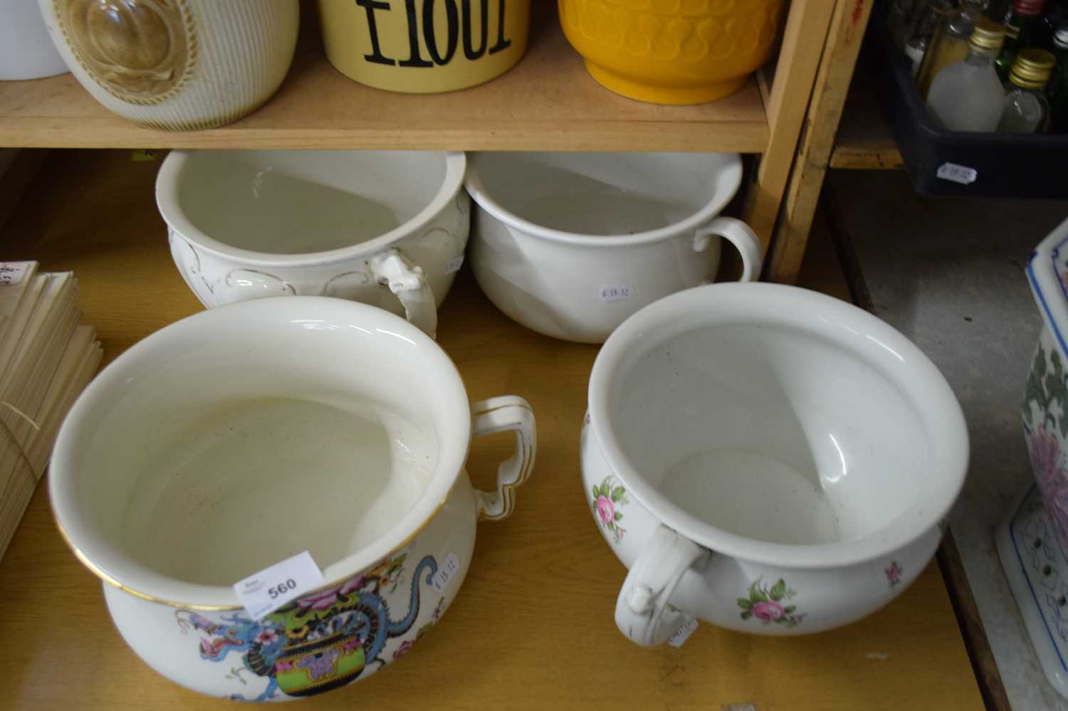 Lot 560 - FOUR VINTAGE CERAMIC CHAMBER POTS