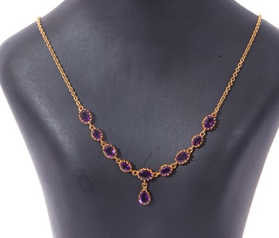 Lot 237 - Modern amethyst necklace, a design featuring...