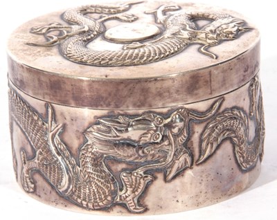 Lot 34 - Chinese white metal circular box with pull off...