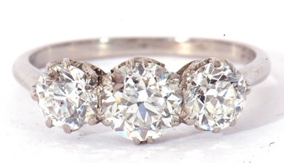 Lot 12a - Three-stone diamond ring featuring three round...