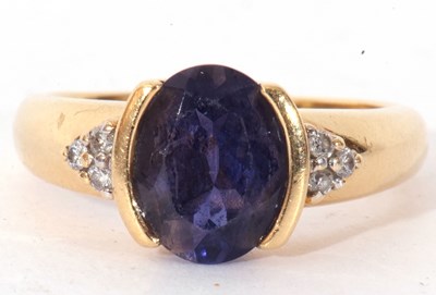 Lot 151 - Modern Iolite and diamond dress ring, the oval...