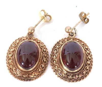 Lot 253a - Pair of yellow metal and garnet set earrings,...