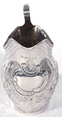 Lot 43 - George III silver helmet formed cream jug with...