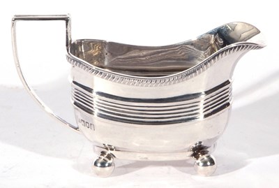 Lot 45 - Edward VII silver cream jug, the body with...