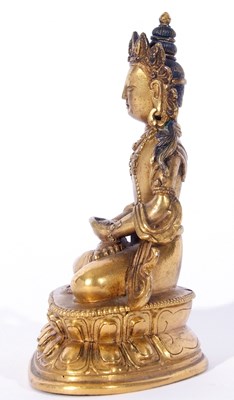Lot 127 - Sino-Tibetan gilt bronze figure of a Buddha...