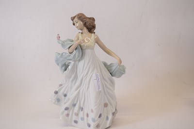 Lot 59 - A Lladro model of a young girl with small bird...