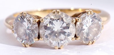 Lot 162 - Three stone diamond ring featuring three round...