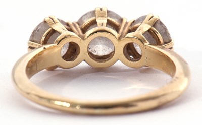 Lot 162 - Three stone diamond ring featuring three round...