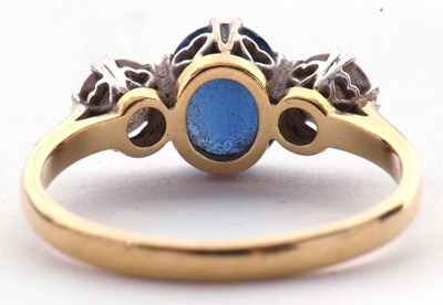 Lot 164 - Sapphire and diamond three stone ring, the...