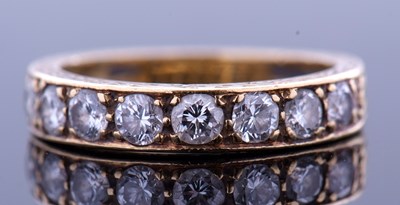 Lot 180 - 18ct gold and diamond half eternity ring,...