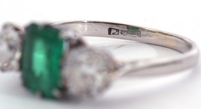 Lot 186 - Emerald and diamond three stone ring, the...